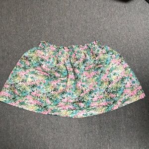 It is a mini skirt with nice spring printings.